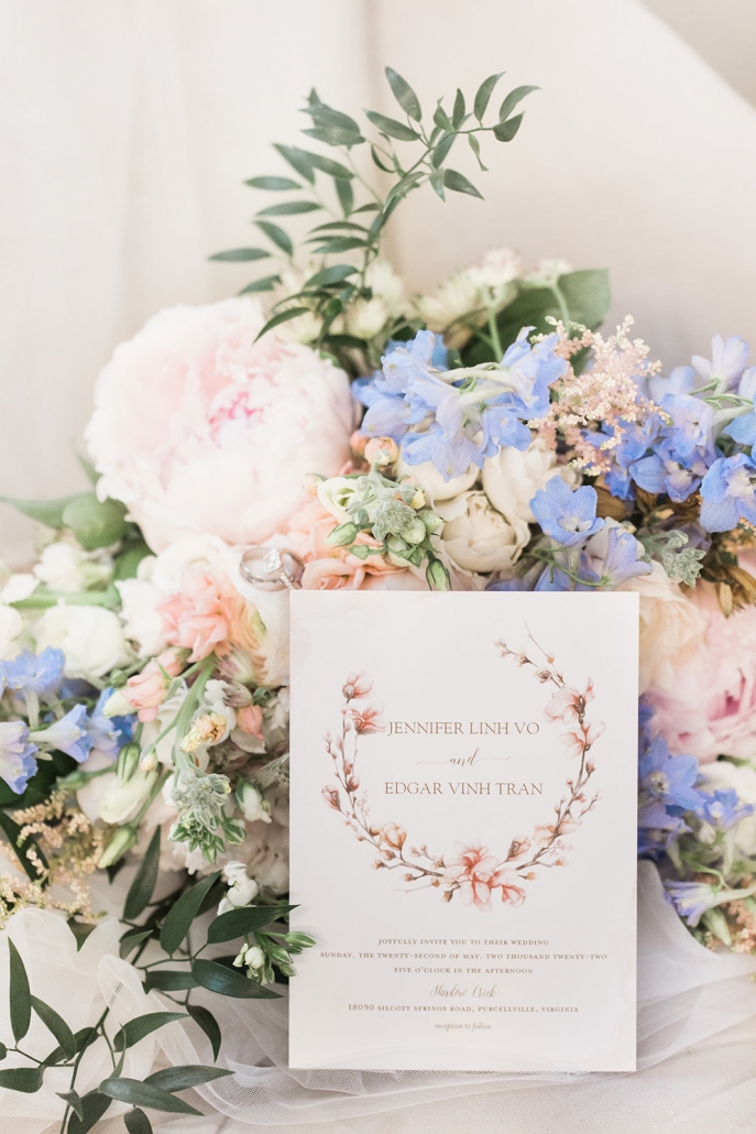 Spring wedding bouquet with formal wedding invitation